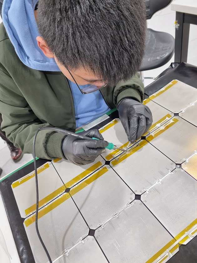 Me soldering solar cells