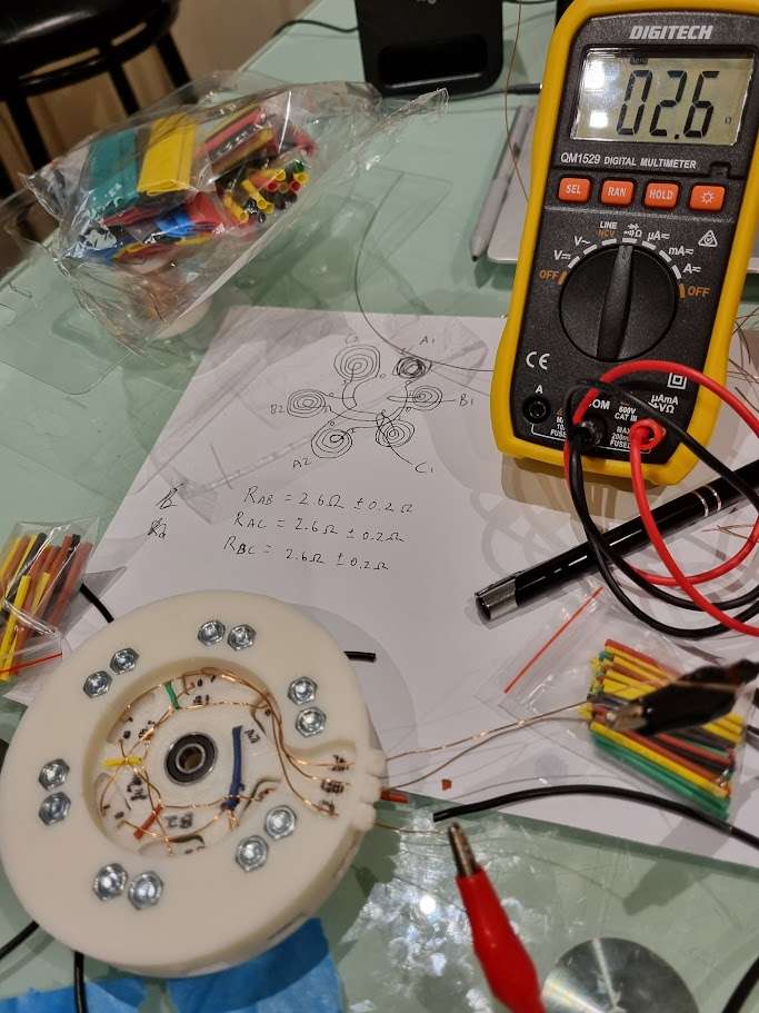Underside of motor, measuring assembled stator coil resistance