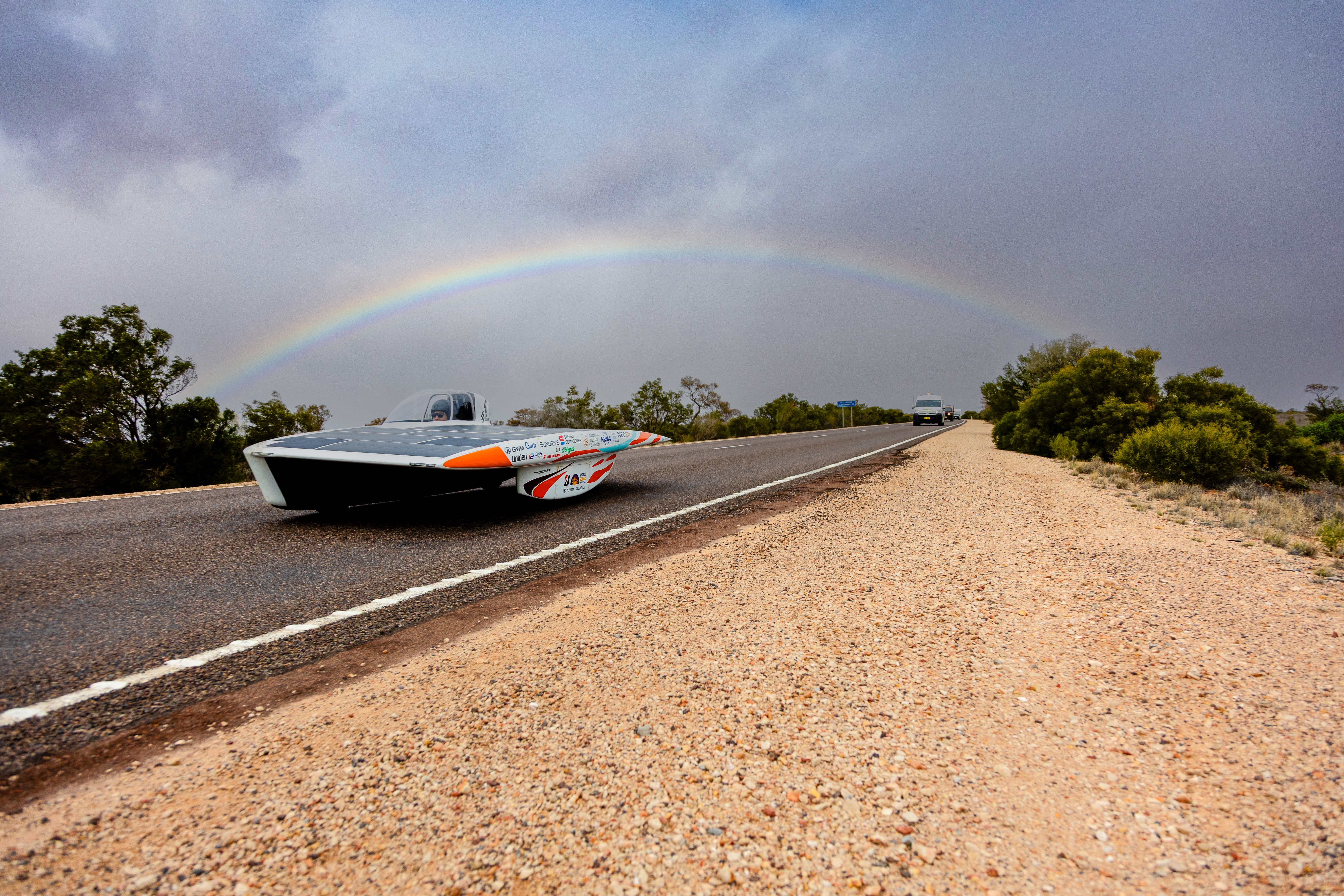 Solar Car in rain with rainbow